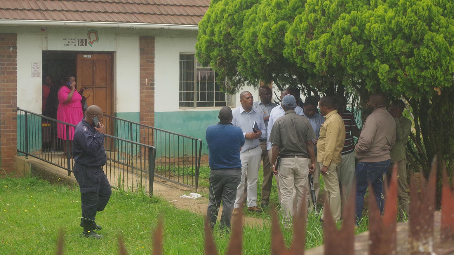 The police investigating team with Mbabane Desk Officer Akhona Dludlu outside the TeBA offices following a robbery where five gunmen reportedly went away with a sum of E111 000. (File pic)